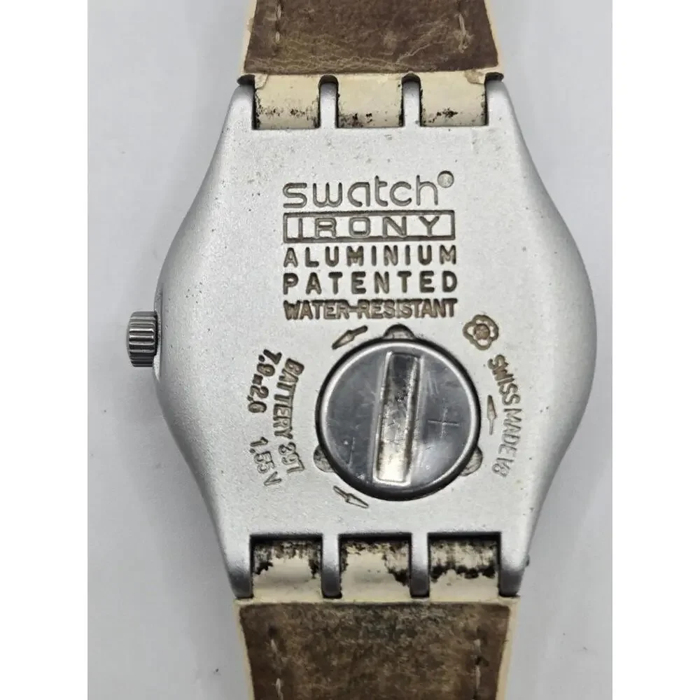 Swatch Women's Silver Case White Strap Watch with Blue Accents